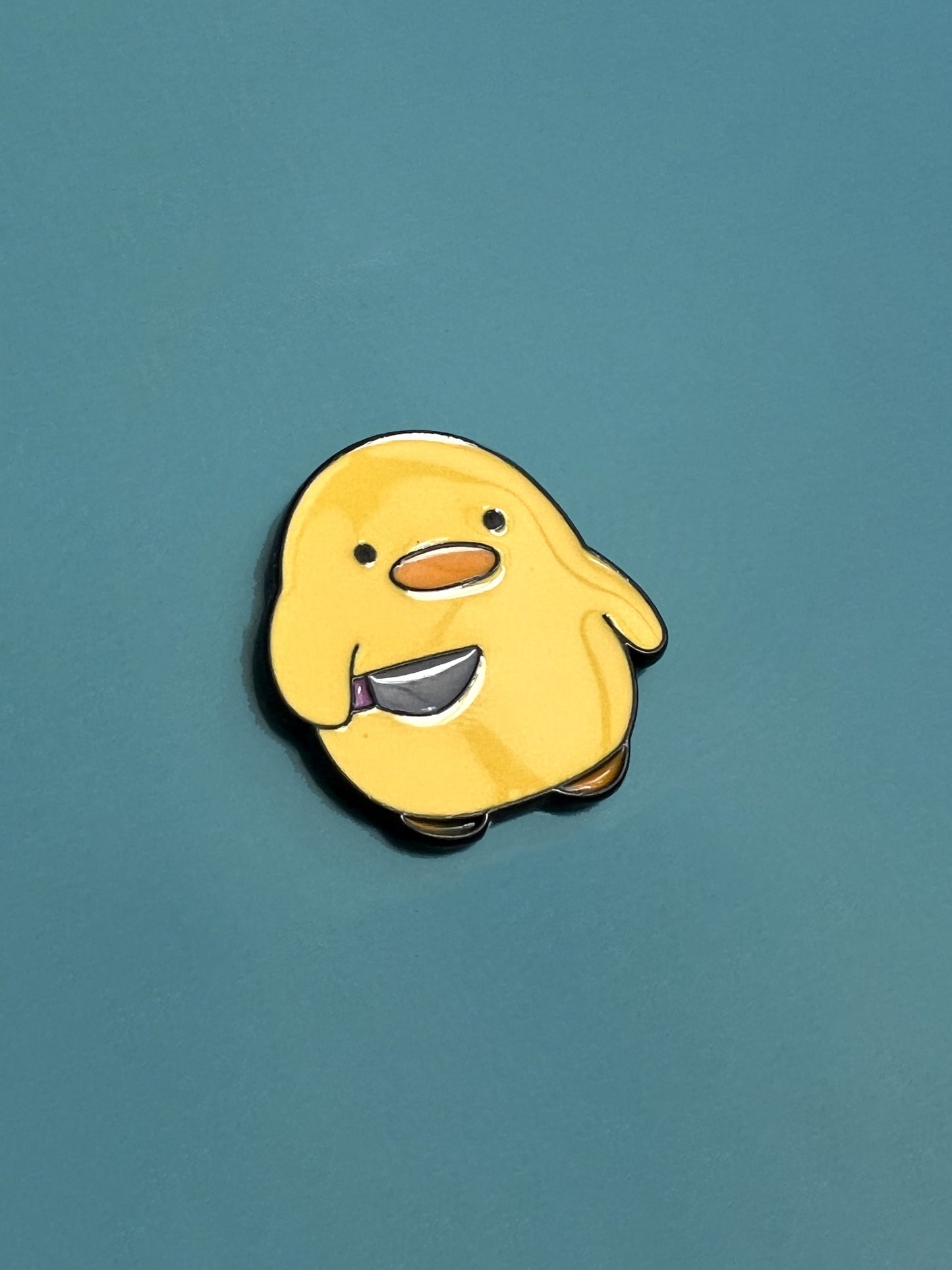 Pollito con cuchillo